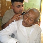 DOD photo by Donna Miles | Army Spc. Tony Montano from the 352nd Combat Support Hospital checks the ears of an 80-year-old Guatemalan man during a five-day medical readiness training exercise in Pocola, Guatemala, June 27, 2010. 