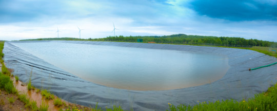 © iStockphoto.com/drnadig | Containment pond for a producing Marcellus shale well site. This pond is used to evaporate contaminated water constantly carried to the surface by natural gas.