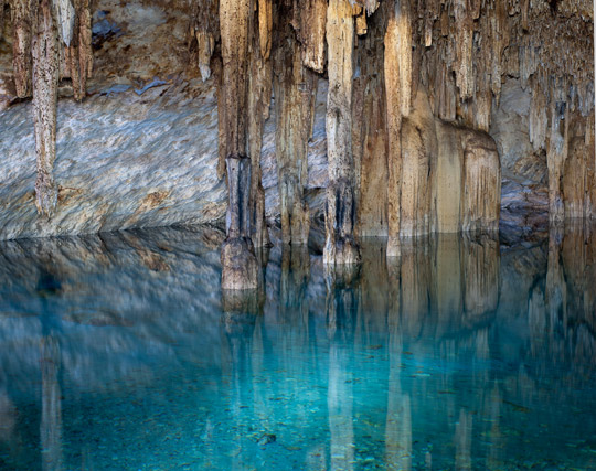 Jack Dykinga|Stalagmites and stalactites with crystal clear tourquise waters of Cenote Papakal, near Merida, Yucatan, Mexico.