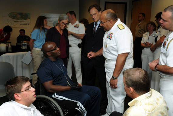 U.S. Navy photo by Mass Communication Specialist 1st Class Joshua Treadwell | Vice Adm. Adam M. Robinson Jr., former Surgeon General of the Navy and Chief of the Navy Bureau of Medicine and Surgery spoke with a wounded warrior at the Lakeshore Foundation in Birmingham, Ala. Lakeshore Foundation recently began a wounded warrior transitioning program called Lima Foxtrot. This event is one of many events held in conjunction with Birmingham Navy Week.