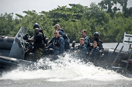 U.S. Navy photo by Mass Communication Specialist 3rd Class Ian Carver | Rear Adm. Kenneth J. Norton, along with other U.S. Navy personnel, ride with a Nigerian visit, board, search and seizure team during Africa Partnership Station West.